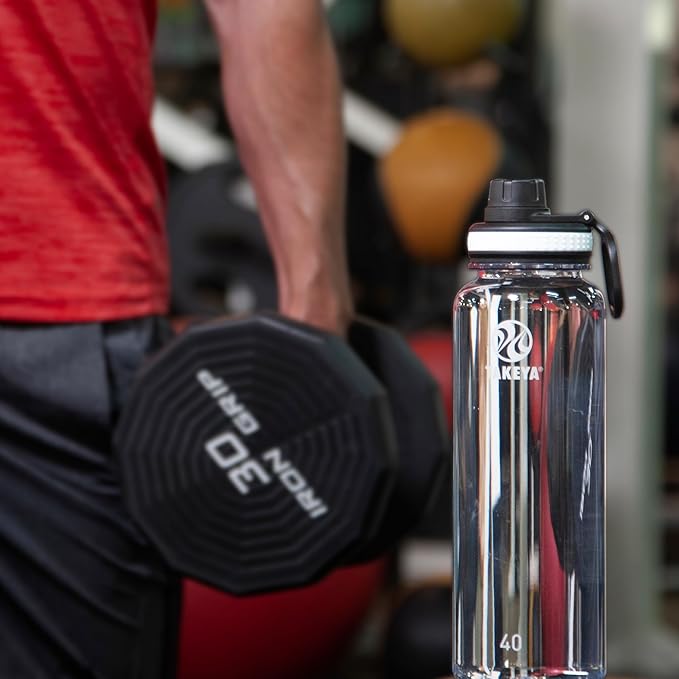 Takeya Tritan Water Bottle with Spout Lid - Durable Dishwasher-Safe Water Bottle - Simple, Modern Bottle - Reusable Water Bottle with Leak-Proof Lid - 40 oz, Clear