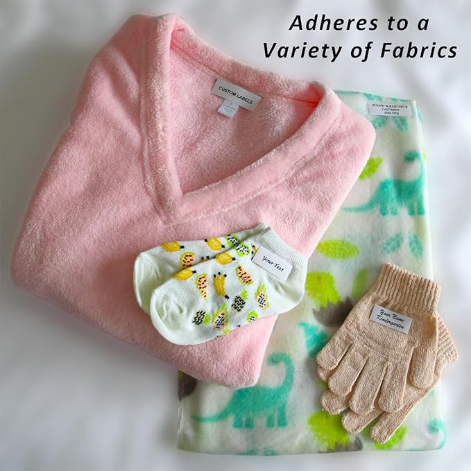 100 PreCut Iron On Personalized Fabric Clothing Name Labels with Font Choice. Custom 2”x5/8” Laundry Tag for Nursing Home, Camp, School, Day Care, Uniforms and Crafts. Child Safe Label.