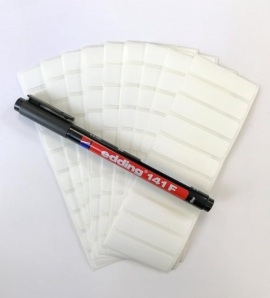 100 Blank Iron-On Clothing Labels with a Black Permanent Laundry Marker.