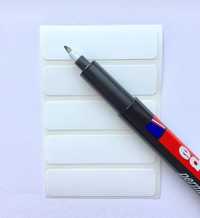 100 Blank Iron-On Clothing Labels with a Black Permanent Laundry Marker.
